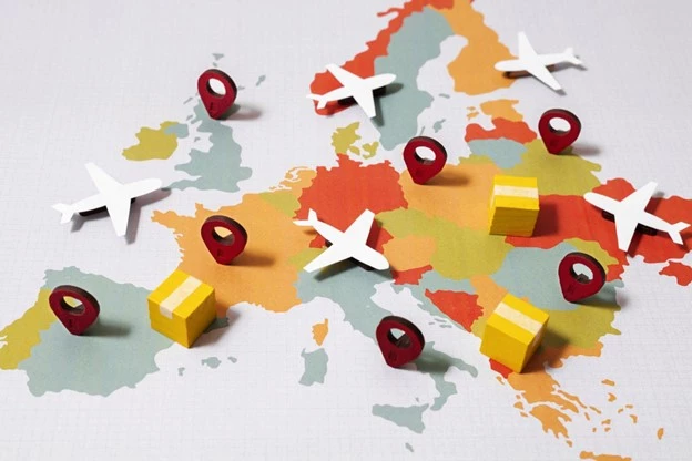Map of Europe with miniature airplanes, location pins, and parcels symbolizing air freight and shipping routes from China to various European destinations.